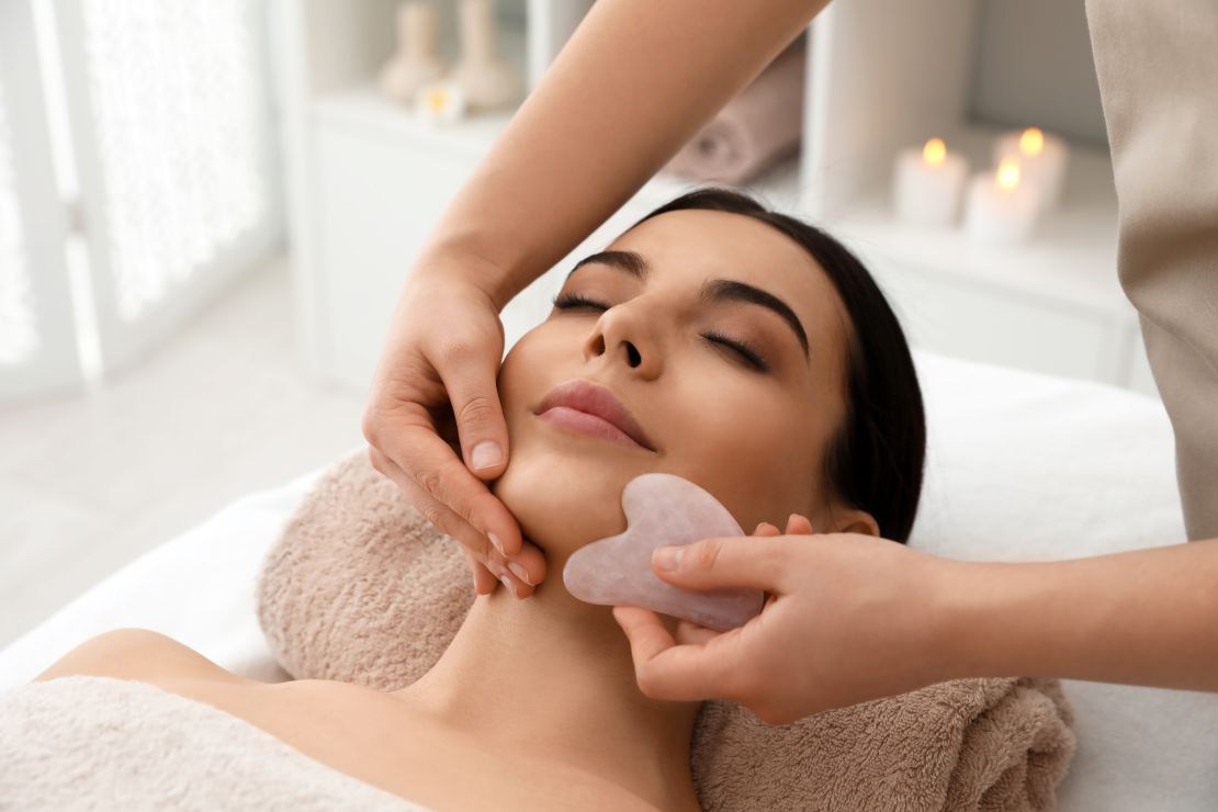 In the photo, Sophie performs a Gua Sha massage on a woman from Belmont, using a smooth tool to apply gentle strokes along specific meridian pathways. This traditional Chinese technique detoxifies the blood, improves Qi flow, and offers lasting benefits such as pain relief, stress reduction, and improved skin health.